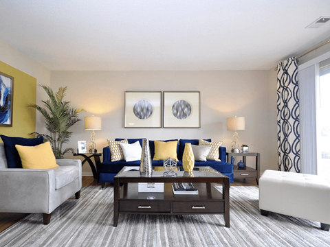 a living room with couches and a coffee table